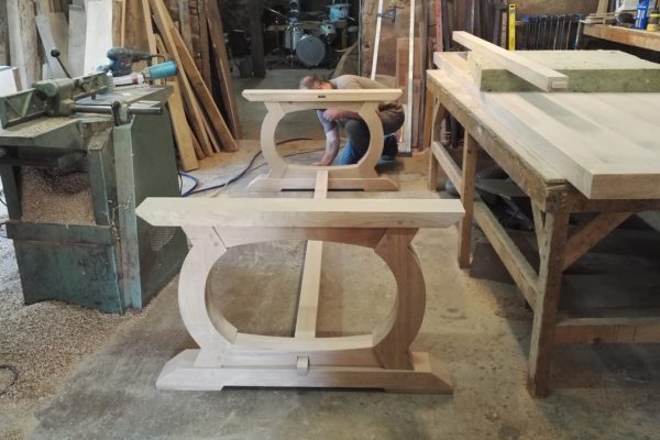 Curved oak table base in progress in the workshop