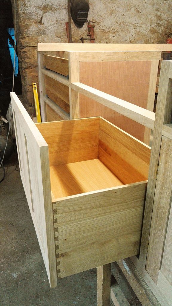 Made to measure soft close bin drawer in oak kitchen unit