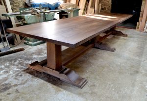 Large oak pedestal table with extending leaves