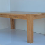Contemporary oak dining table with slim drawers