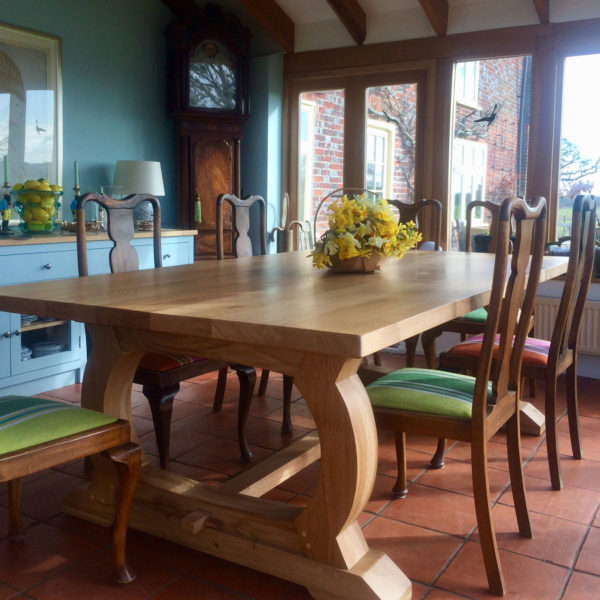 Curved base refectory table