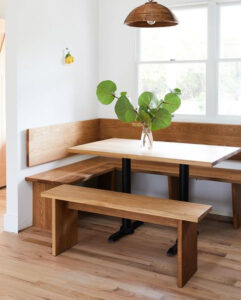 Corner dining nook with wooden benches