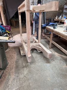 The base is wheeled out of the way whilst we work on the table top