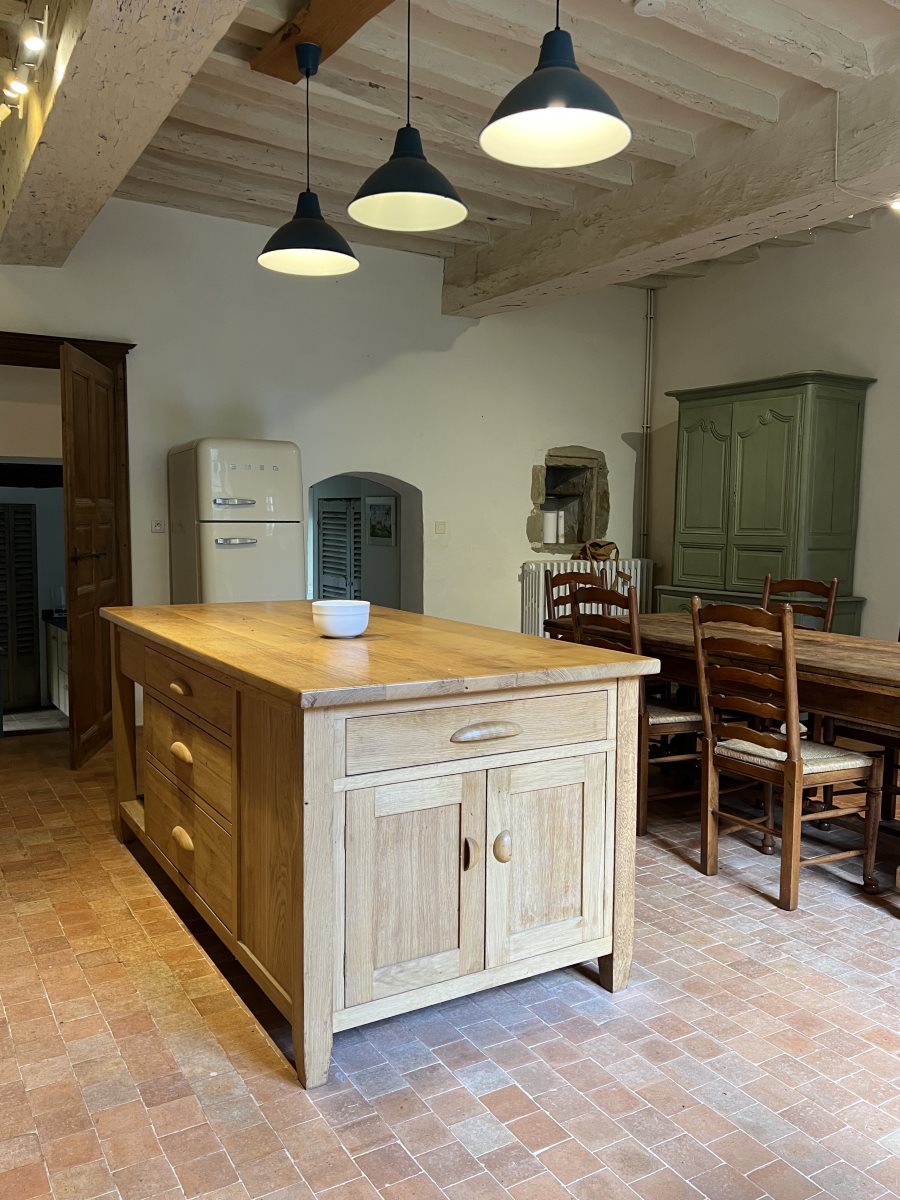 French country kitchen with handmade oak island